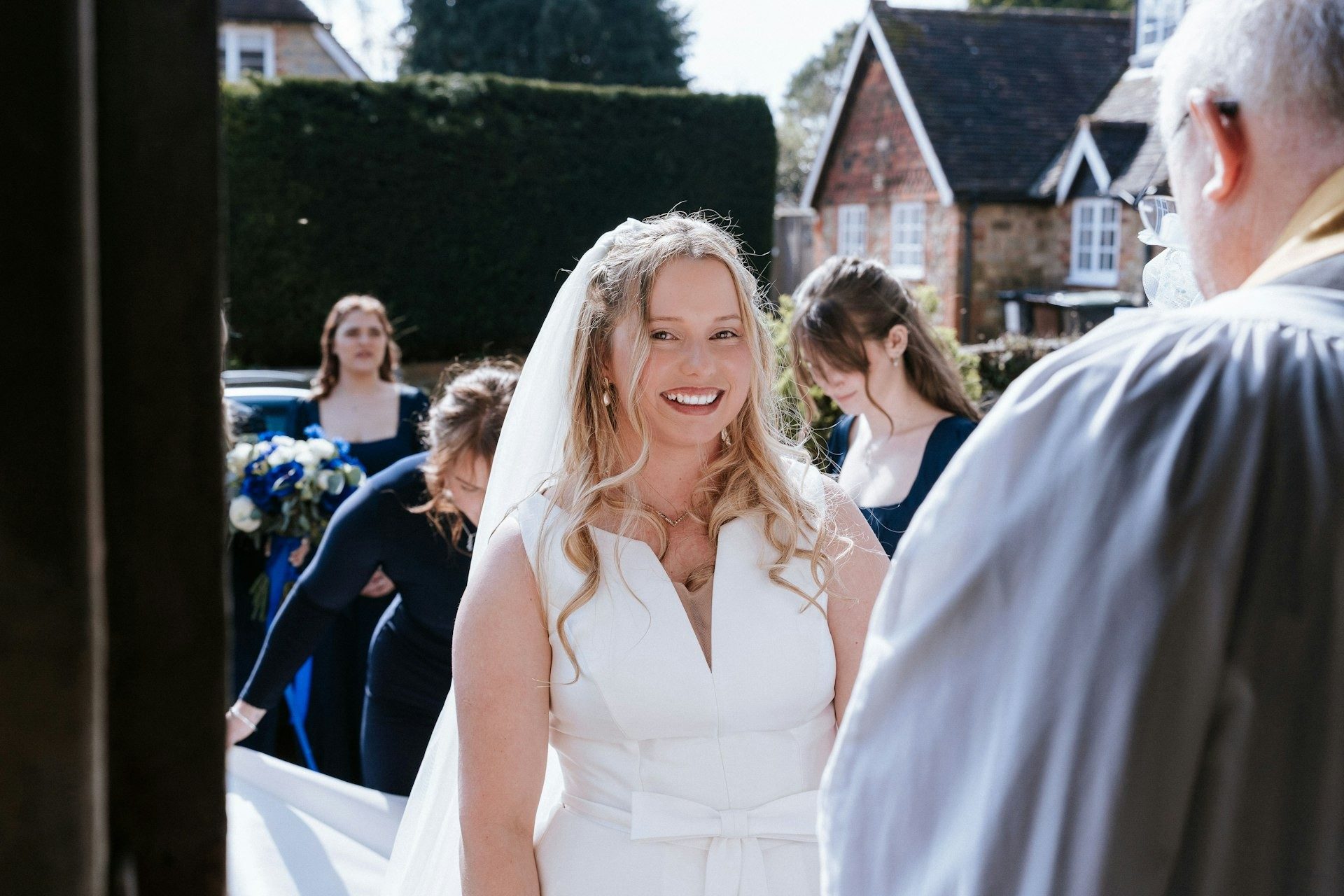 Bride beams as she leaves the ceremony
