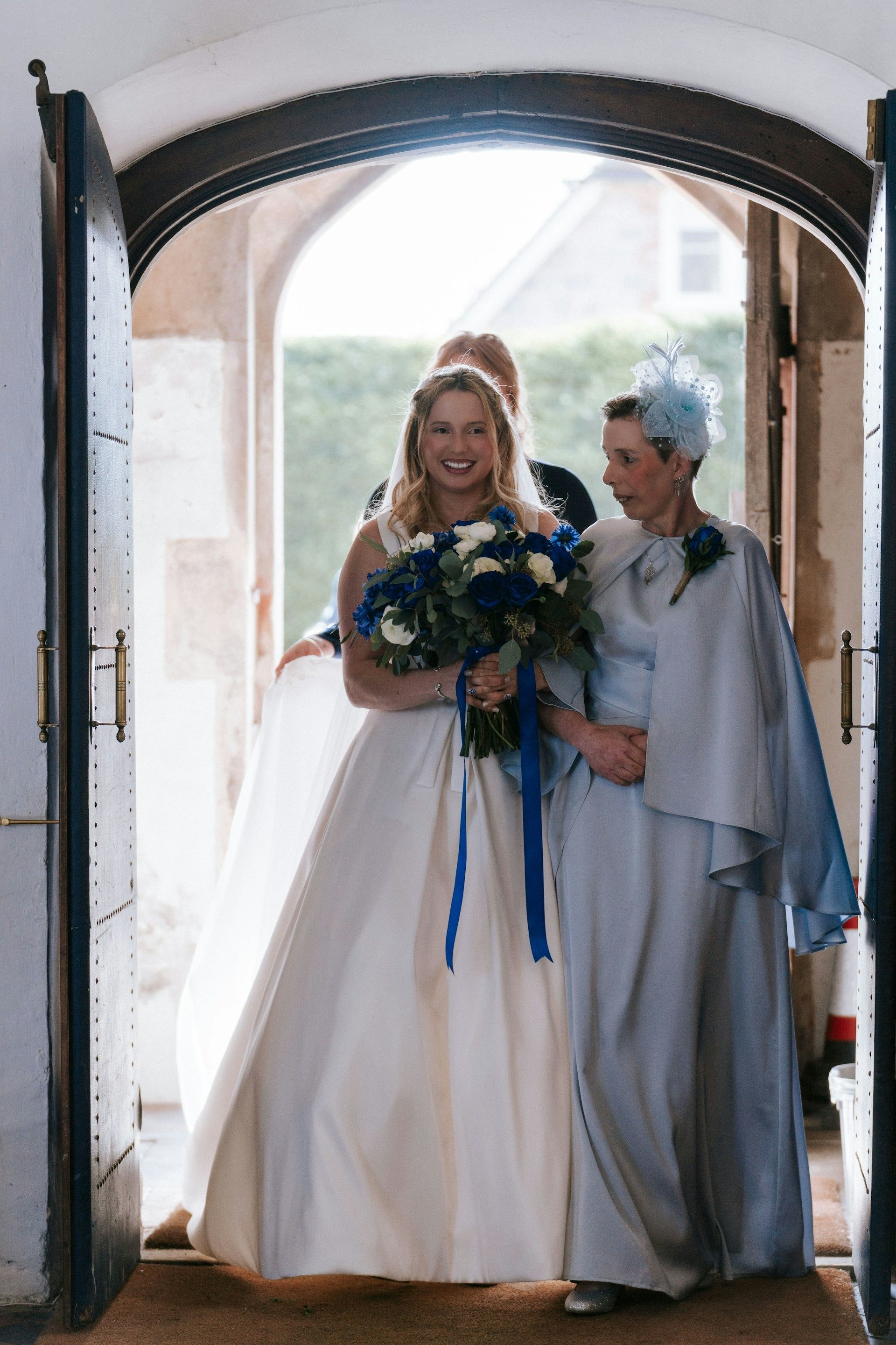Bride arrives at the church door with her bouquet