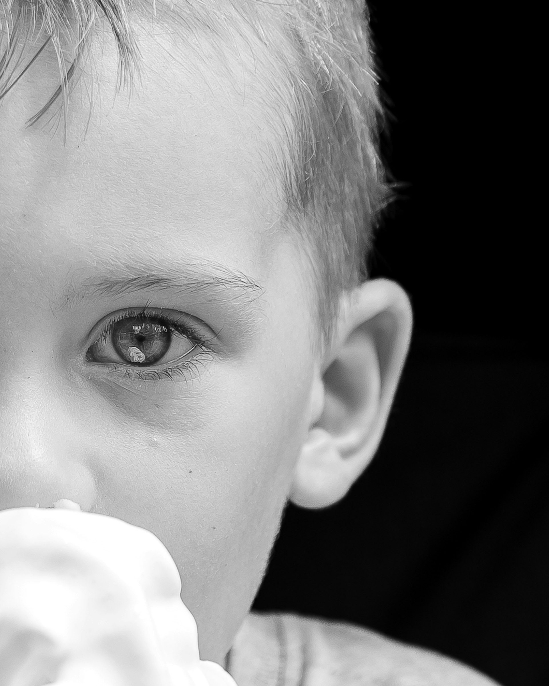 Close up of a child’s eye, in black and white