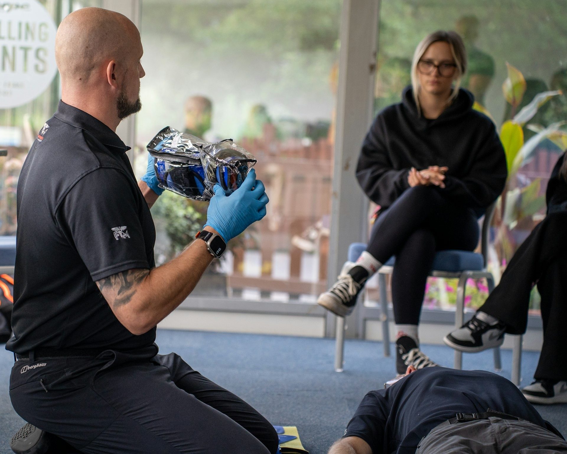 First-aid instructor demonstrates a technique to the class