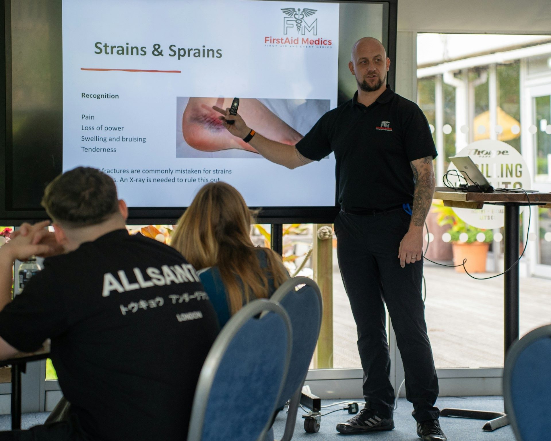 Trainer presents to a first-aid class