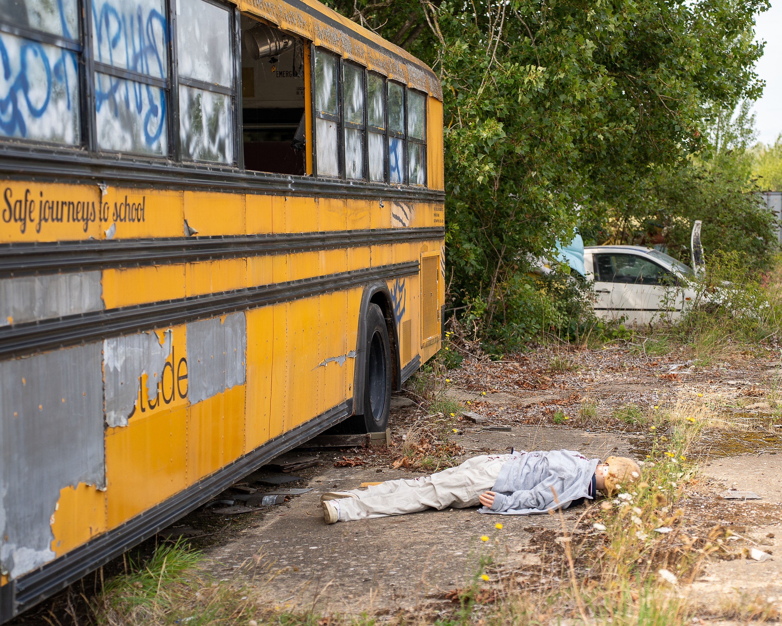 Training scenario staged around a yellow school bus